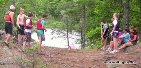 Gould Lake, summer camp folk play a game at a stop along the Tom Dixon Trail.